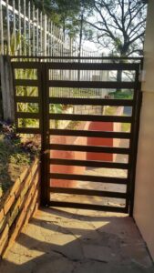 Custom Swing Gates: Securing Front Doors From Intruders